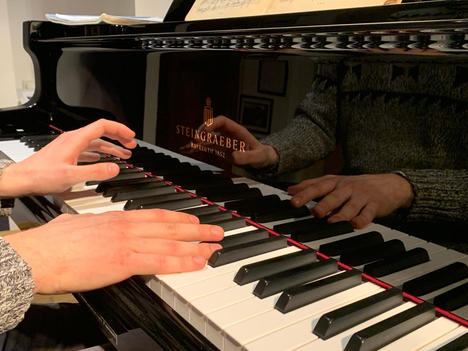 Adam Dvořáček at the piano - hands portrait